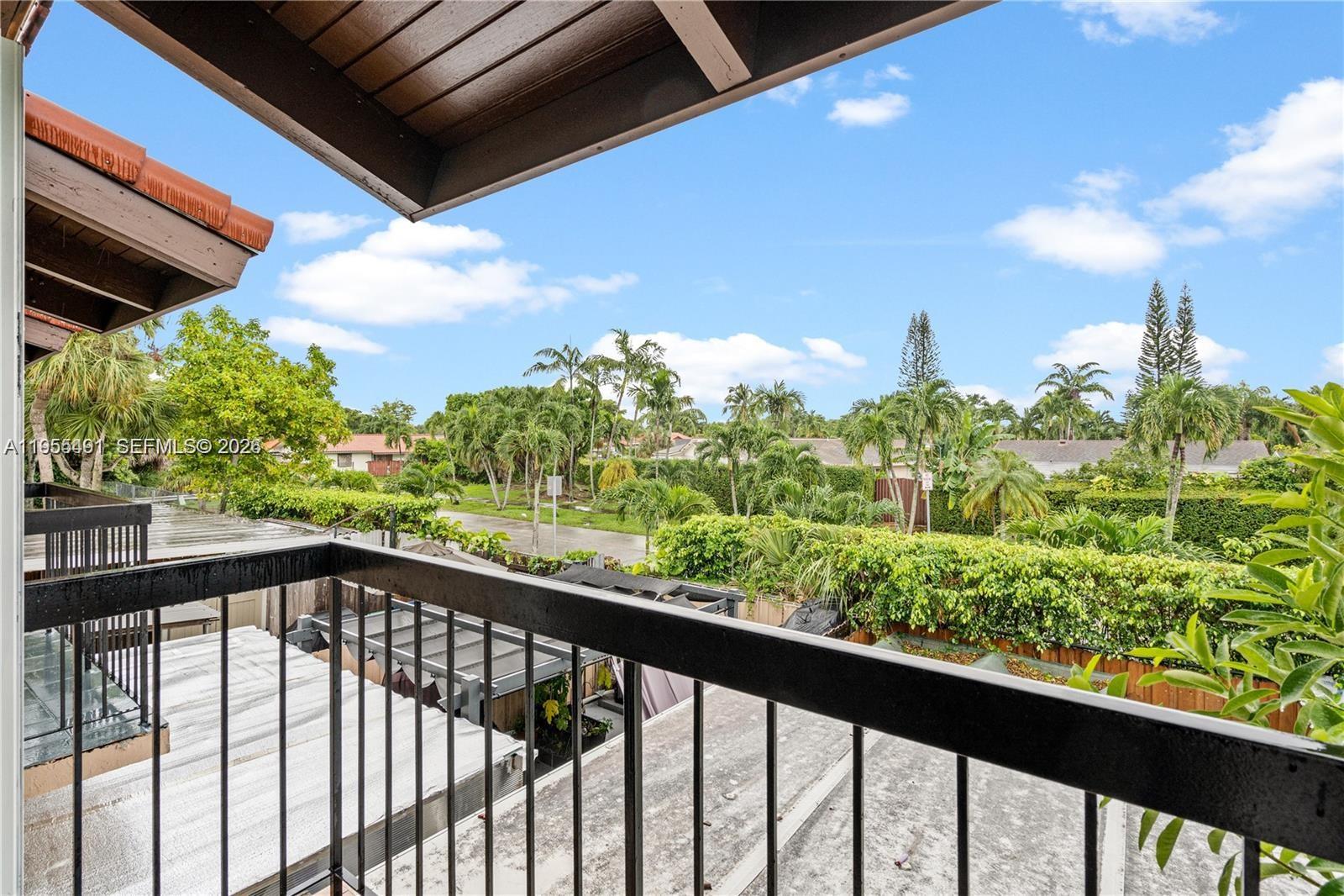 1927 Southwest 107th Avenue, Unit 306 Miami, FL 33165 - Photo 22 of 23 a view of a city from a balcony