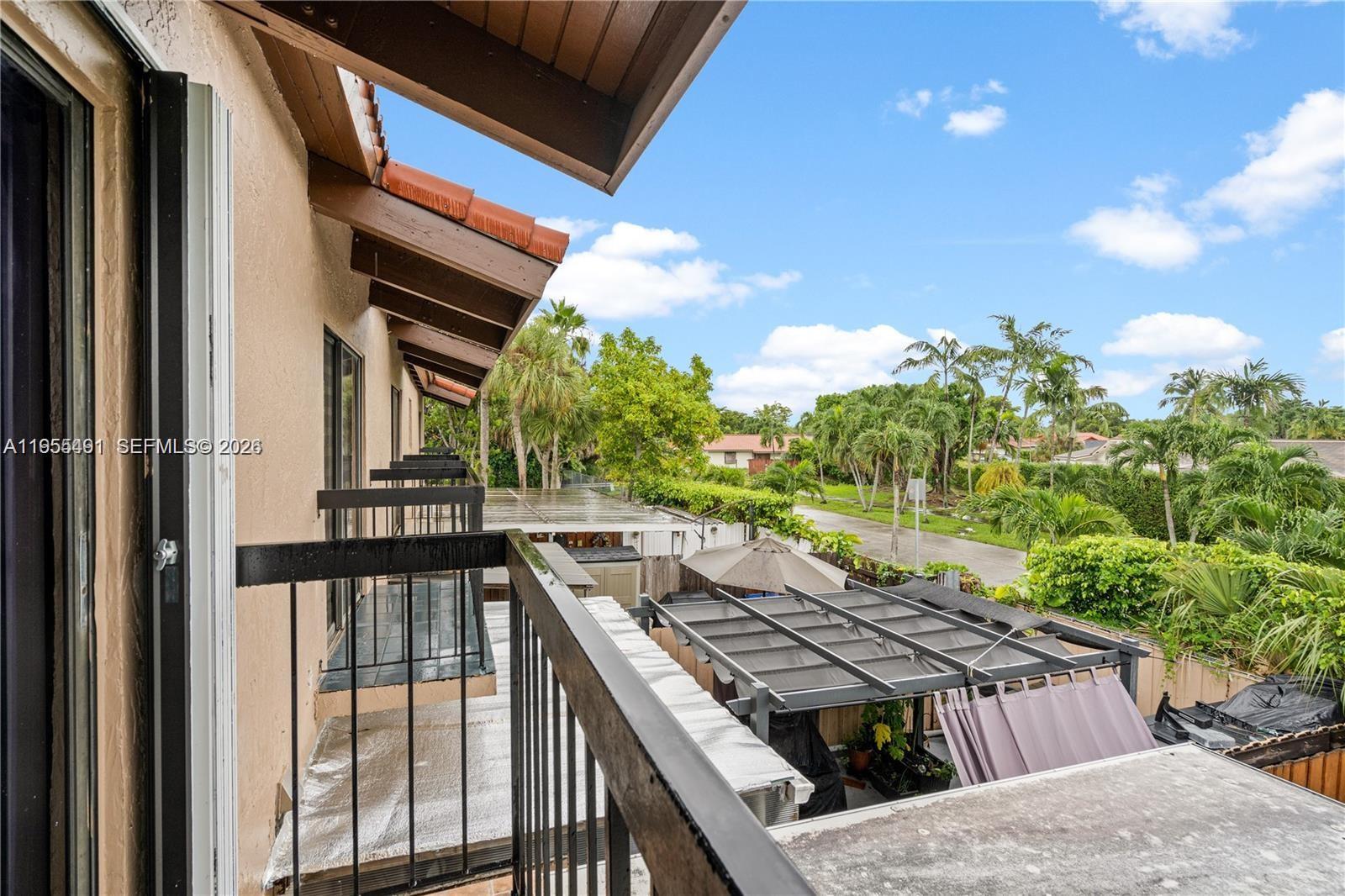 1927 Southwest 107th Avenue, Unit 306 Miami, FL 33165 - Photo 23 of 23 a view of a backyard with sitting area