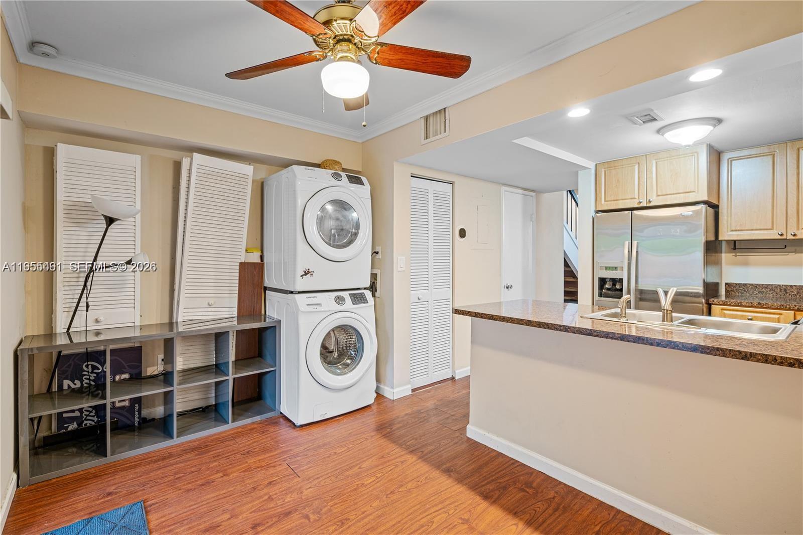 1927 Southwest 107th Avenue, Unit 306 Miami, FL 33165 - Photo 9 of 23 a kitchen with stainless steel appliances granite countertop a sink and cabinets
