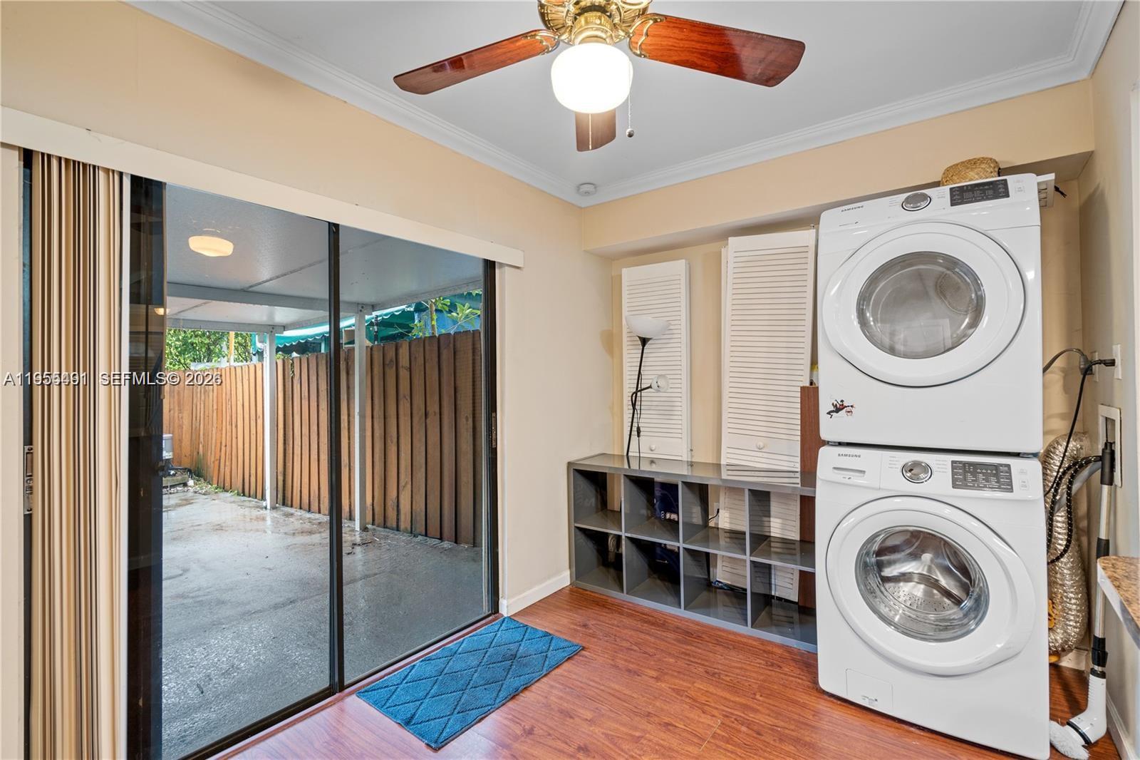 1927 Southwest 107th Avenue, Unit 306 Miami, FL 33165 - Photo 10 of 23 a view of a hallway with washer and dryer