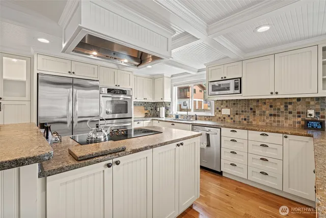 a kitchen with counter top space cabinets and stainless steel appliances