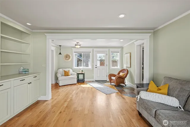 a bedroom with furniture and wooden floor