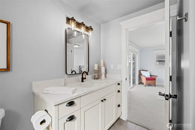 a bathroom with a sink and a mirror