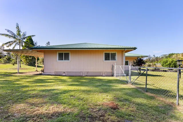 a swimming pool with outdoor seating and yard