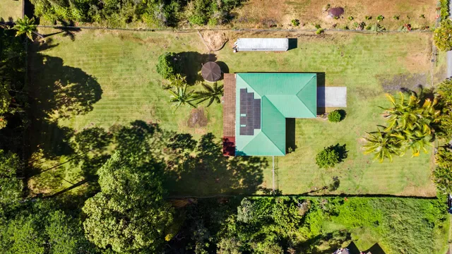 aerial view of a houses with yard