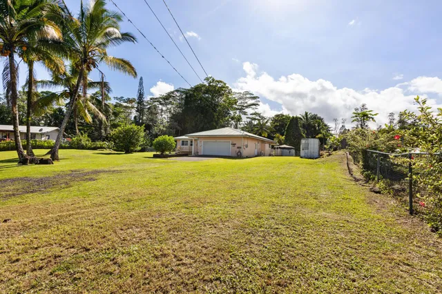 a view of a swimming pool with an outdoor space and seating area