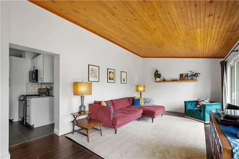 a living room with furniture and a table
