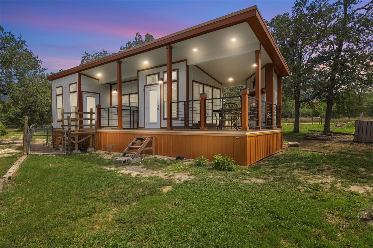 1705 Makinson Road West Point, TX 78963 - Photo 1 of 40 An inviting front porch and deck extend the living space of this charming residence, perfect for outdoor enjoyment.