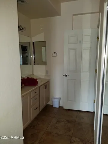 a spacious bathroom with a shower and a sink