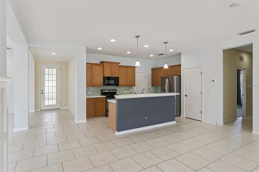 5312 Tide Point Way Bradenton, FL 34208 - Photo 16 of 40 a view of kitchen with kitchen island stainless steel appliances refrigerator sink and cabinets