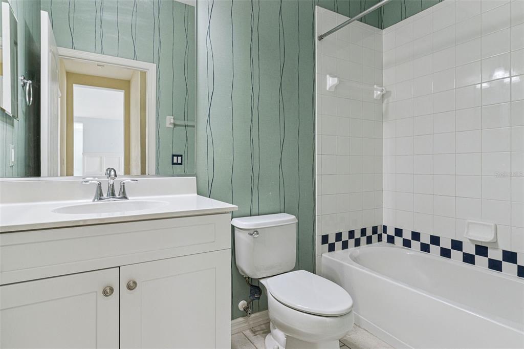 5312 Tide Point Way Bradenton, FL 34208 - Photo 22 of 40 a bathroom with a sink a toilet and a mirror