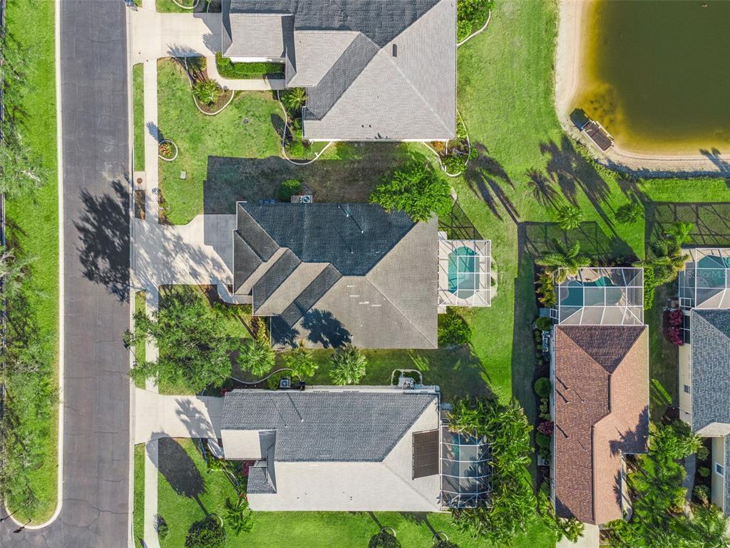 5312 Tide Point Way Bradenton, FL 34208 - Photo 33 of 40 an aerial view of a house with a yard and garden