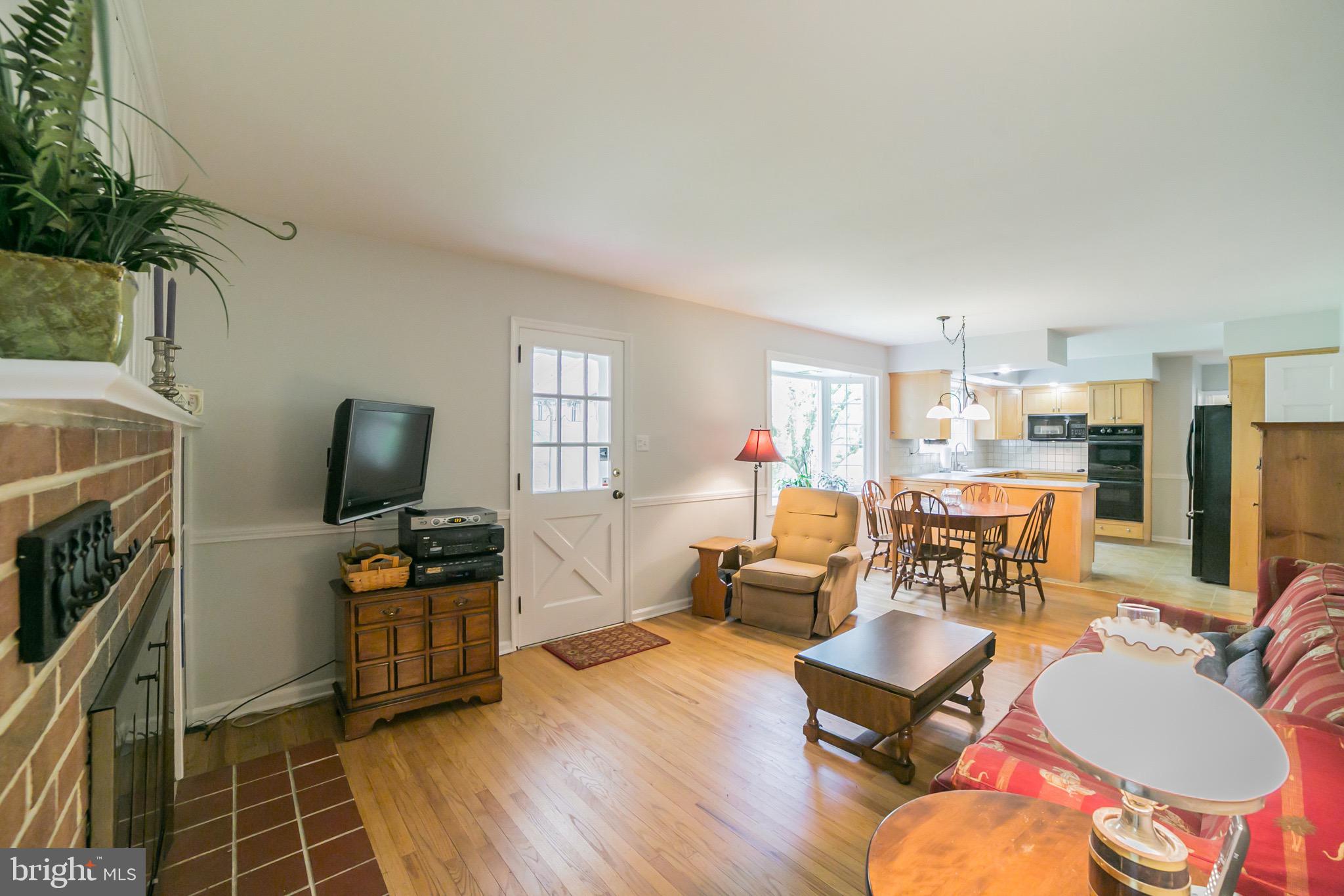 71 Peddrick Road Wayne, PA 19087 - Photo 22 of 47 Family rm has pretty brick fireplace and wood flr
