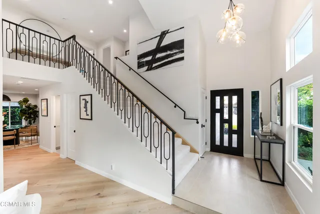 a view of staircase with lots of frames and stairs