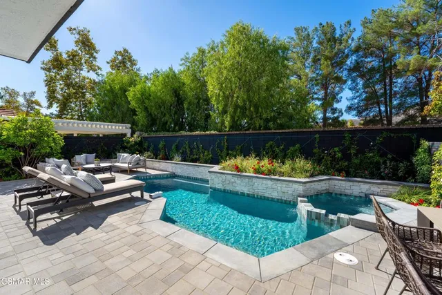 a view of a patio with couches chairs and a fire pit