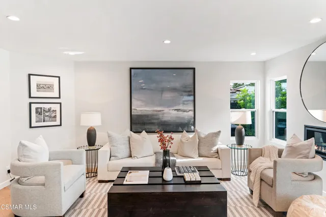 a spacious bedroom with a large bed and a couch