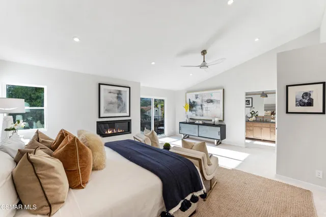 a view of a livingroom with furniture and a flat screen tv