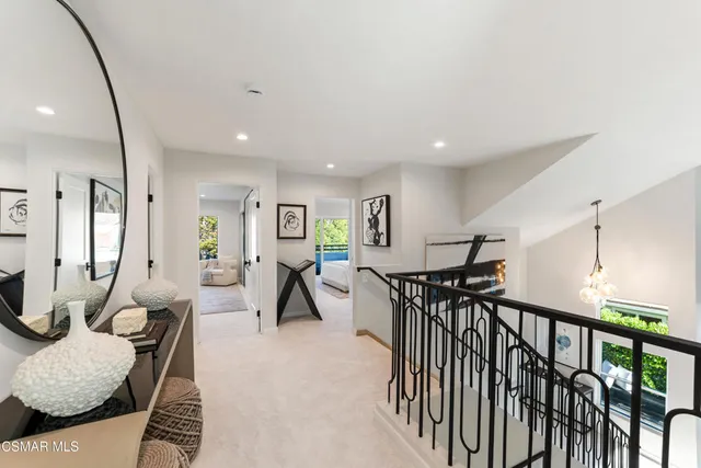 a spacious bedroom with a bed and a couch