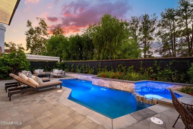a view of a patio with couches chairs and potted plants