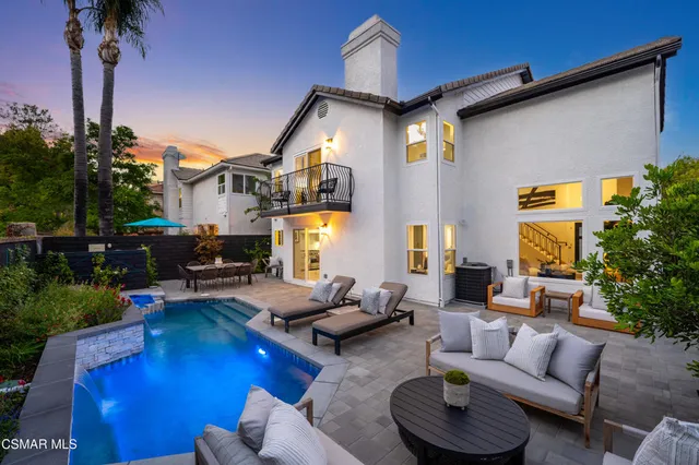 an aerial view of residential houses and lake view