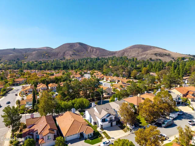 an aerial view of residential house and sandy dunes
