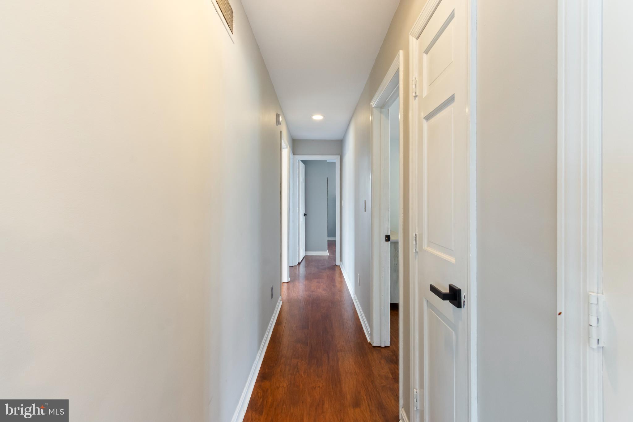 620 South Frizzellburg Road Westminster, MD 21158 - Photo 16 of 64 Inviting hallway with warm wooden floors.