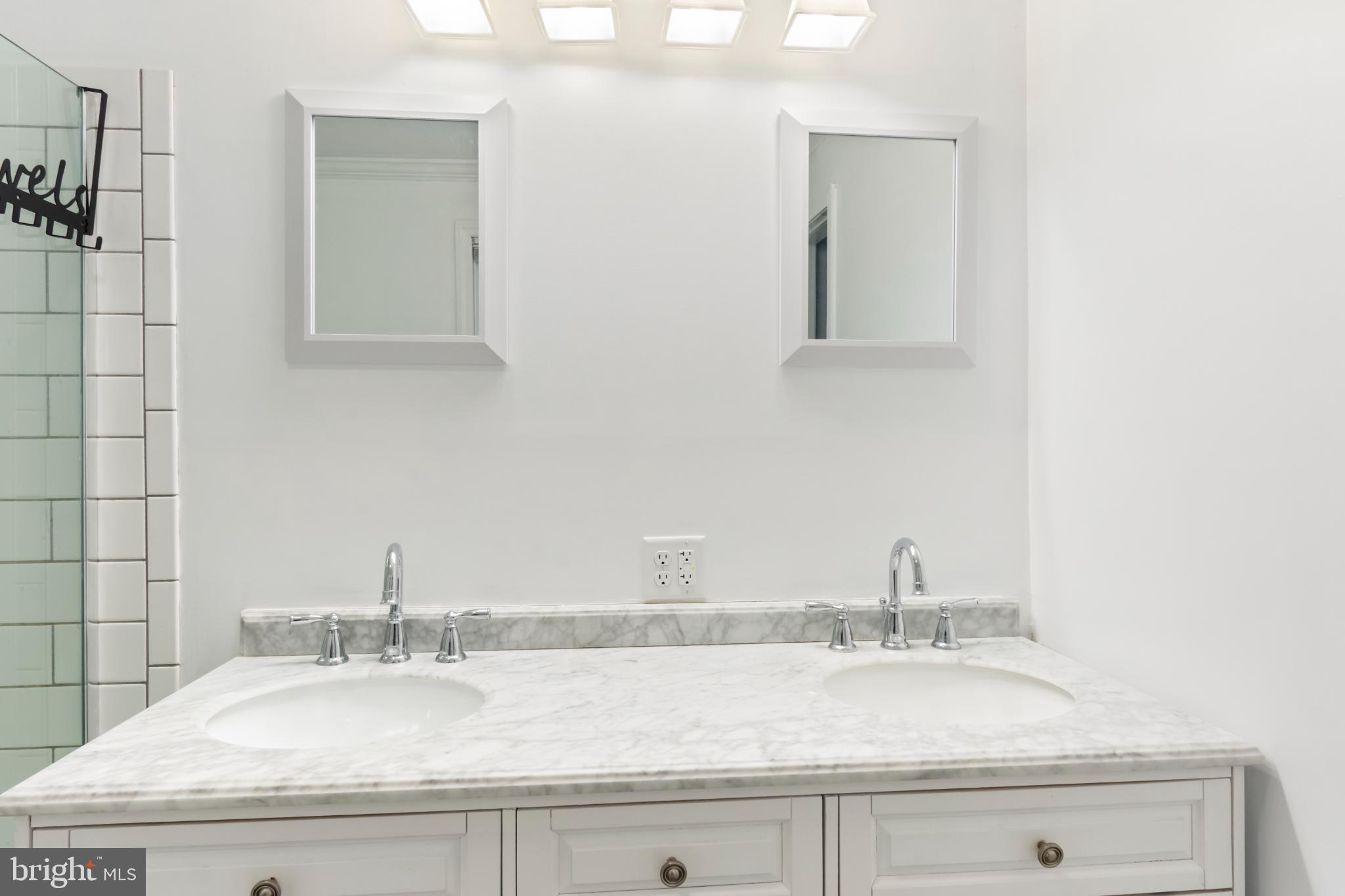 620 South Frizzellburg Road Westminster, MD 21158 - Photo 23 of 64 Sleek dual vanity in a modern bathroom.