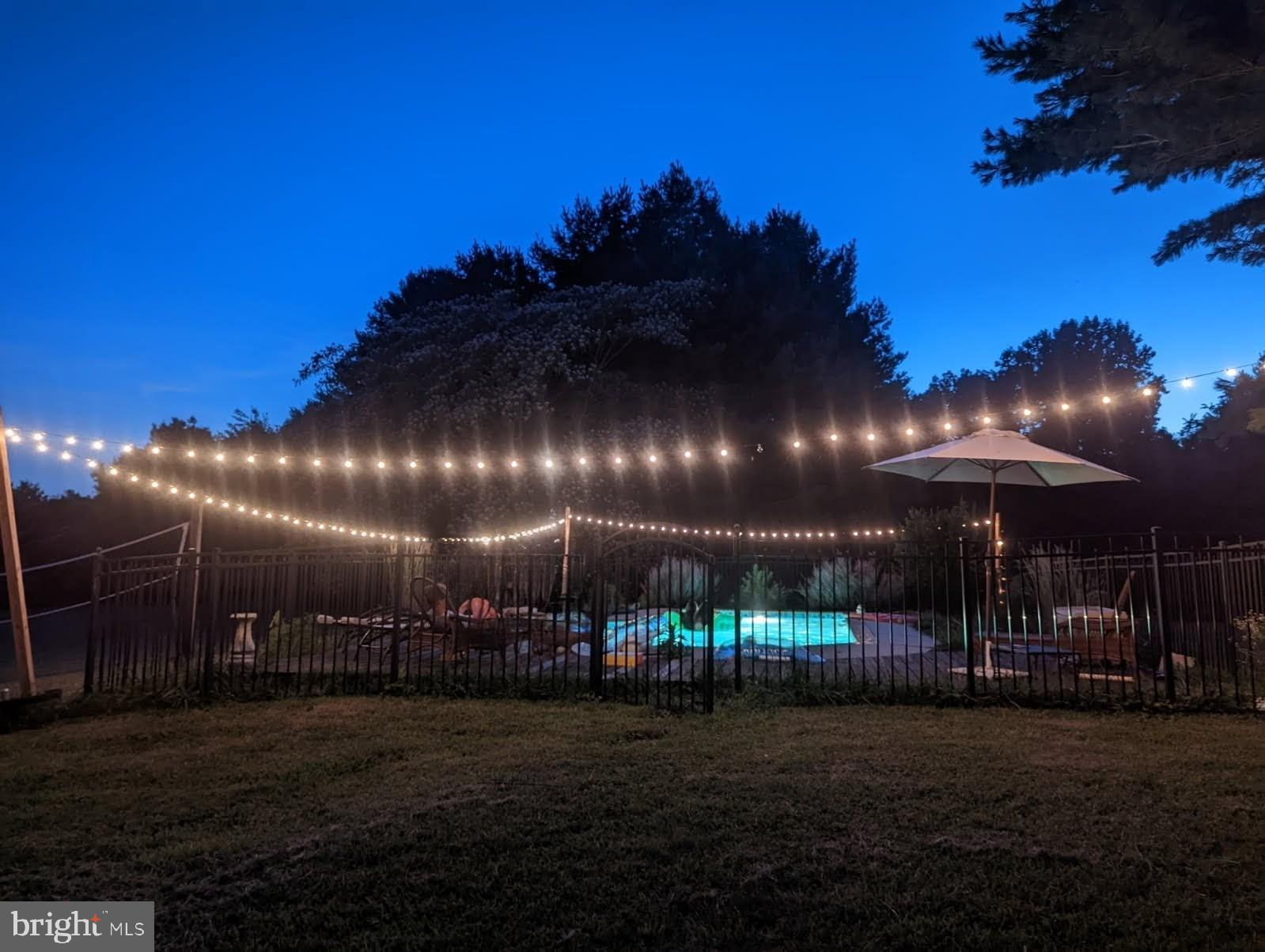 620 South Frizzellburg Road Westminster, MD 21158 - Photo 45 of 61 Twinkling lights over a serene poolside.