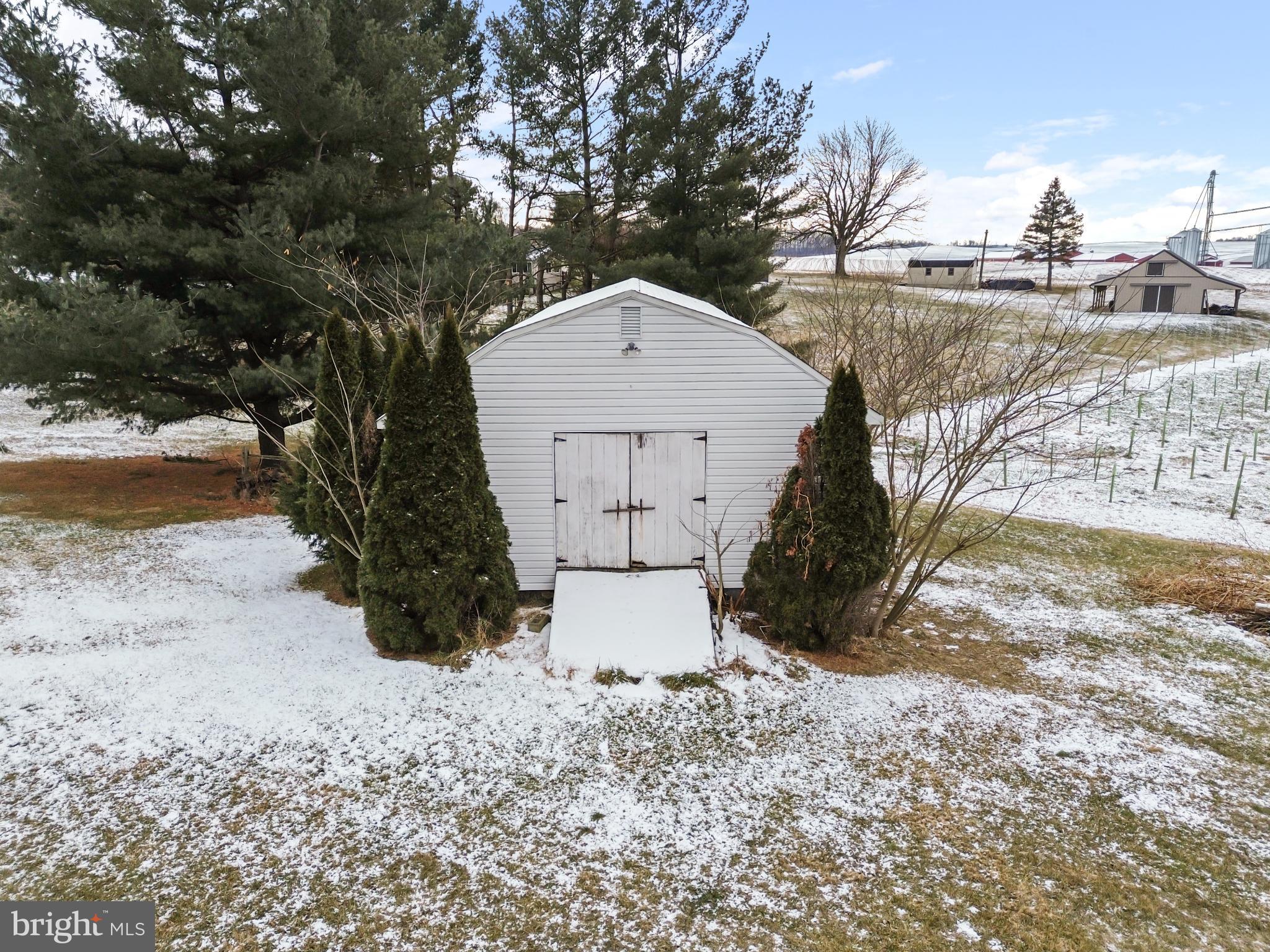 620 South Frizzellburg Road Westminster, MD 21158 - Photo 48 of 61 Charming shed nestled in a snowy landscape.