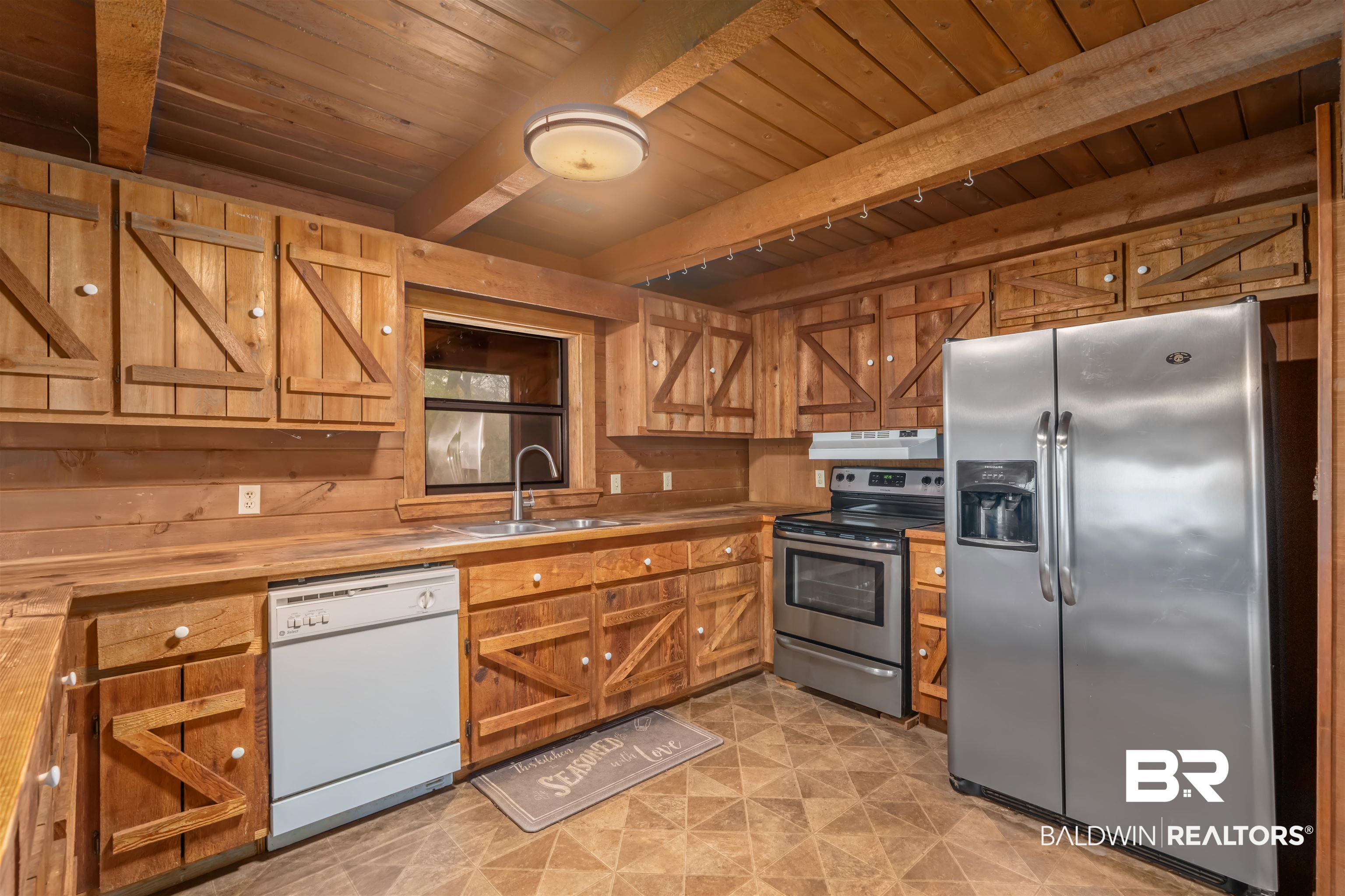 4131 Greaves Road Eight Mile, AL 36613 - Photo 4 of 39 Kitchen featuring appliances with stainless steel finishes, beam ceiling, sink, and wooden ceiling