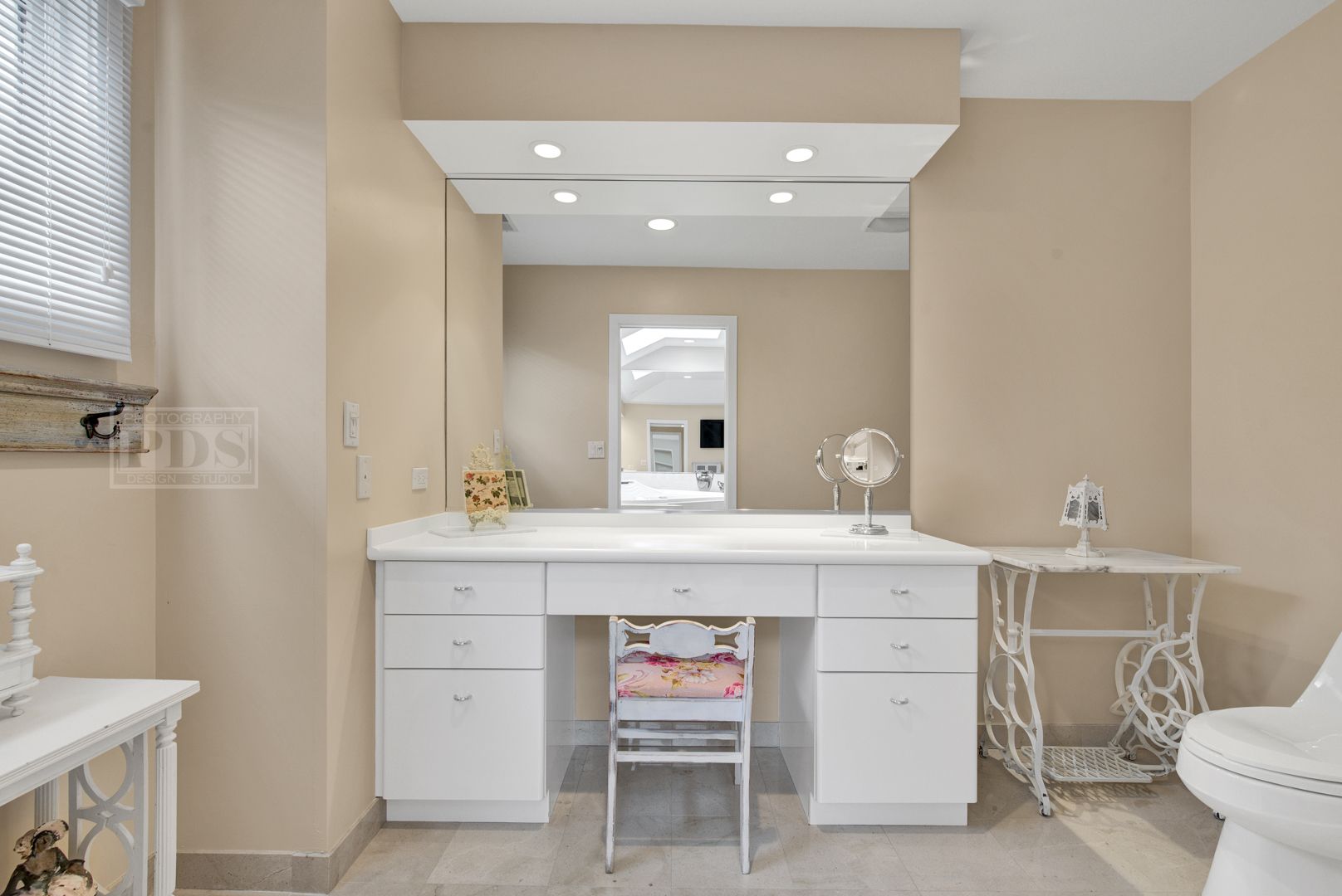 2067 Sheridan Road Buffalo Grove, IL 60089 - Photo 29 of 53 a spacious bathroom with a double vanity sink toilet and a mirror