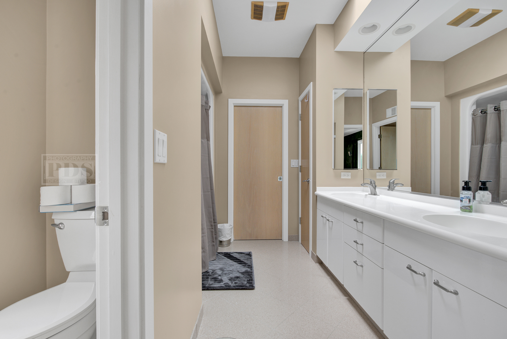 2067 Sheridan Road Buffalo Grove, IL 60089 - Photo 31 of 53 a spacious bathroom with a double vanity sink toilet and shower