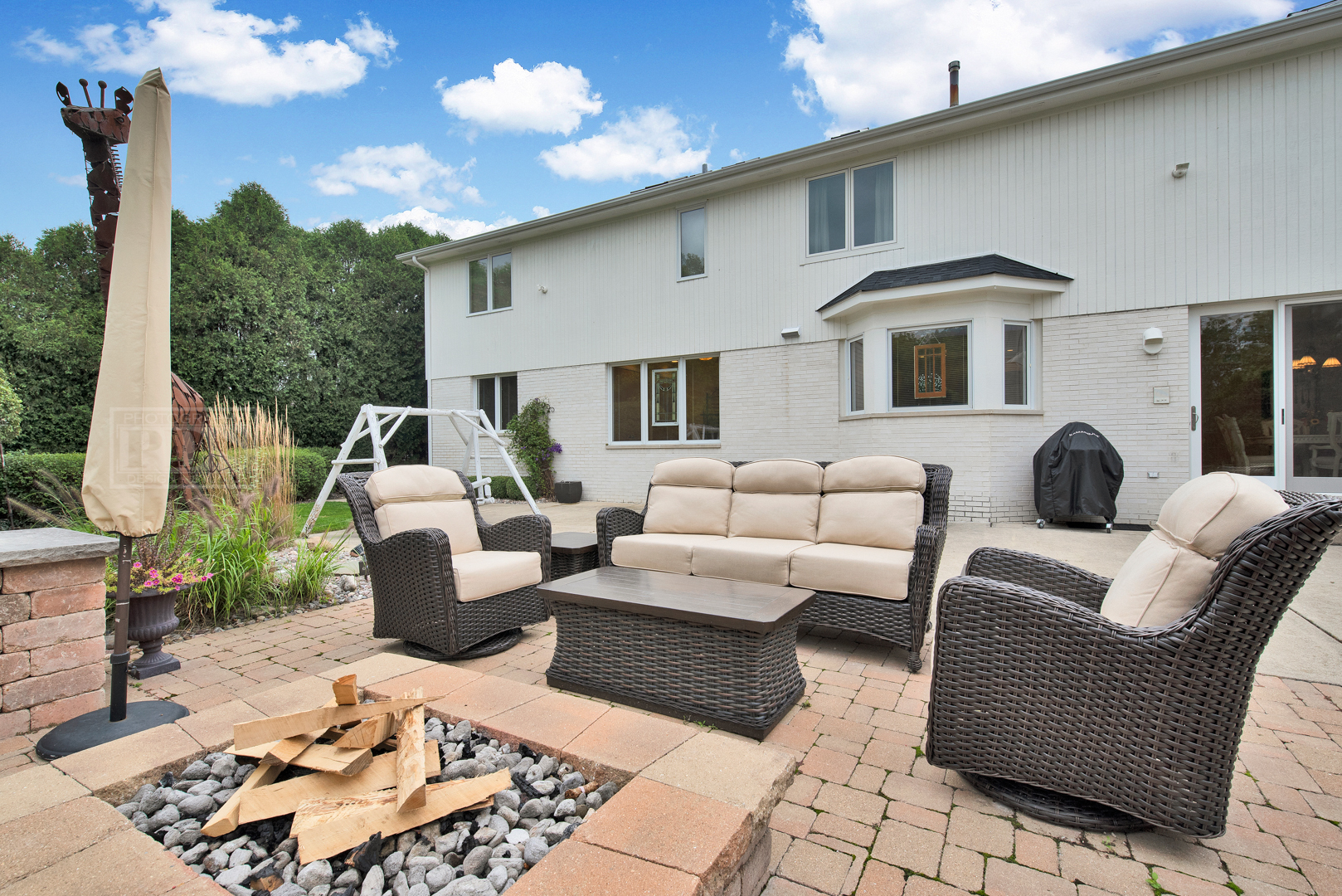 2067 Sheridan Road Buffalo Grove, IL 60089 - Photo 48 of 53 a view of a patio with couches chairs and potted plants