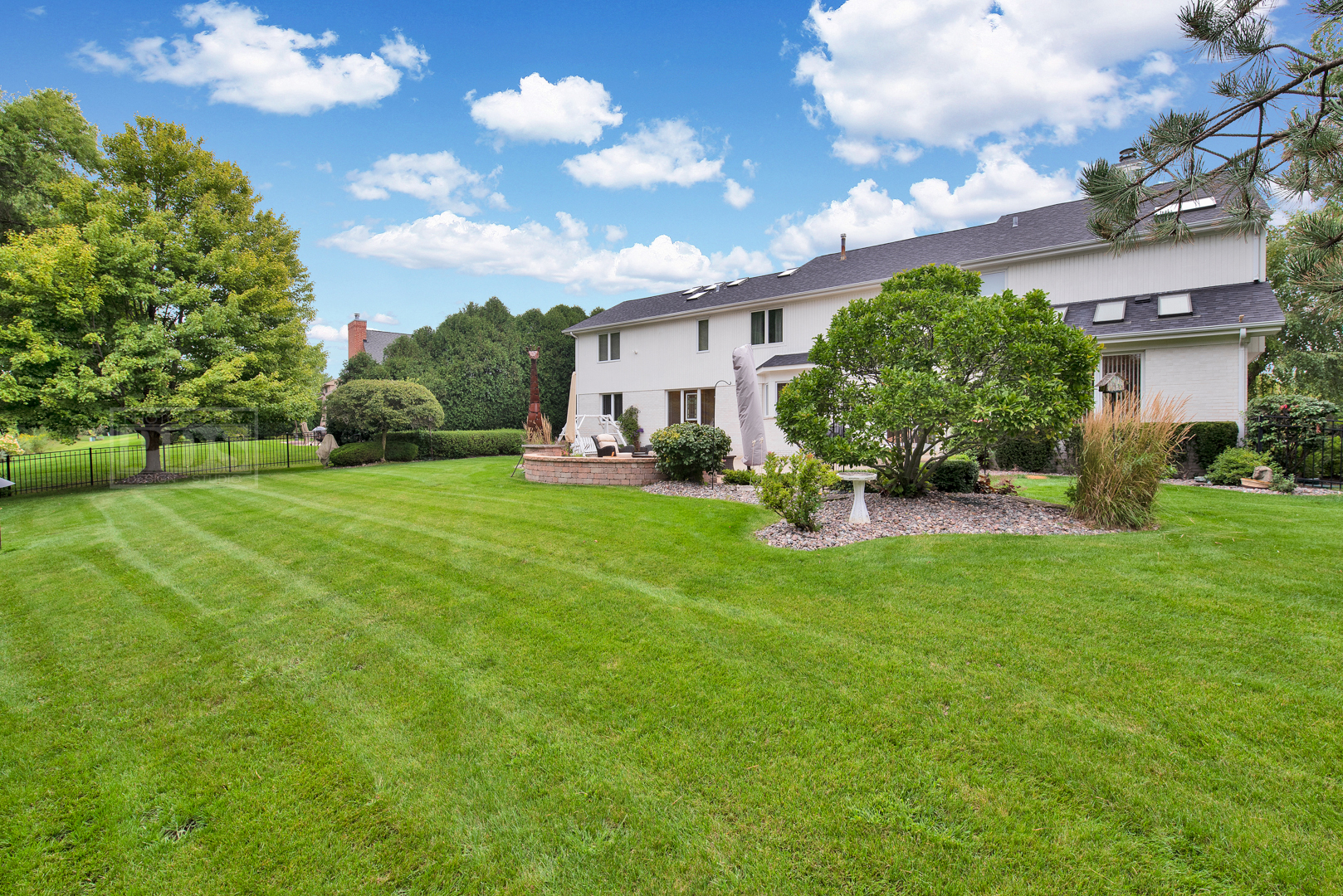 2067 Sheridan Road Buffalo Grove, IL 60089 - Photo 52 of 53 a view of a house with a big yard and a large tree