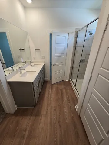 a view of a bathroom with sink and mirror