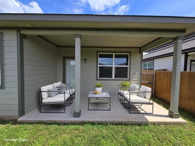 a outdoor space with patio furniture and potted plants