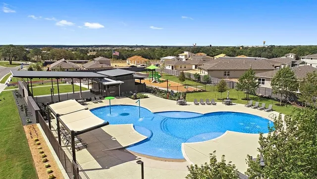 a front view of a house with a yard and a garage