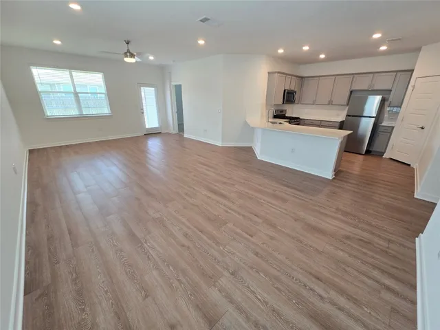 a view of kitchen with wooden floor