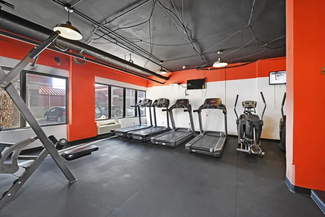 a view of a room with gym equipment