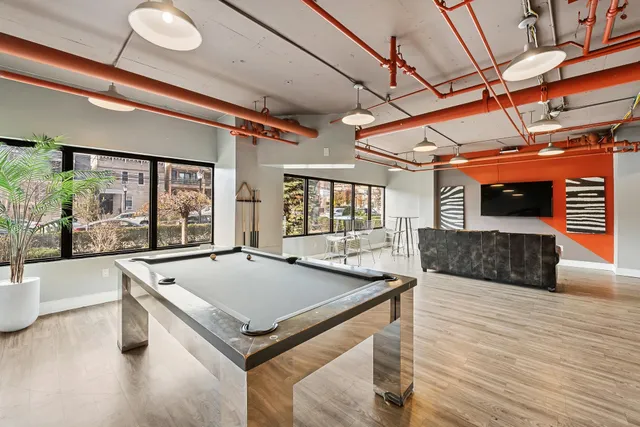 a room with wooden floor and furniture