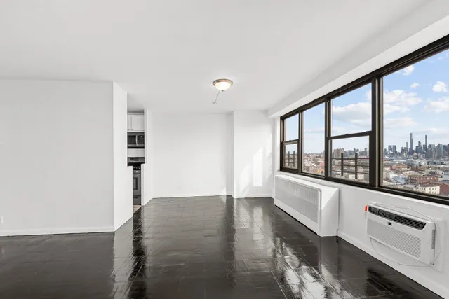 a view of an empty room with a window