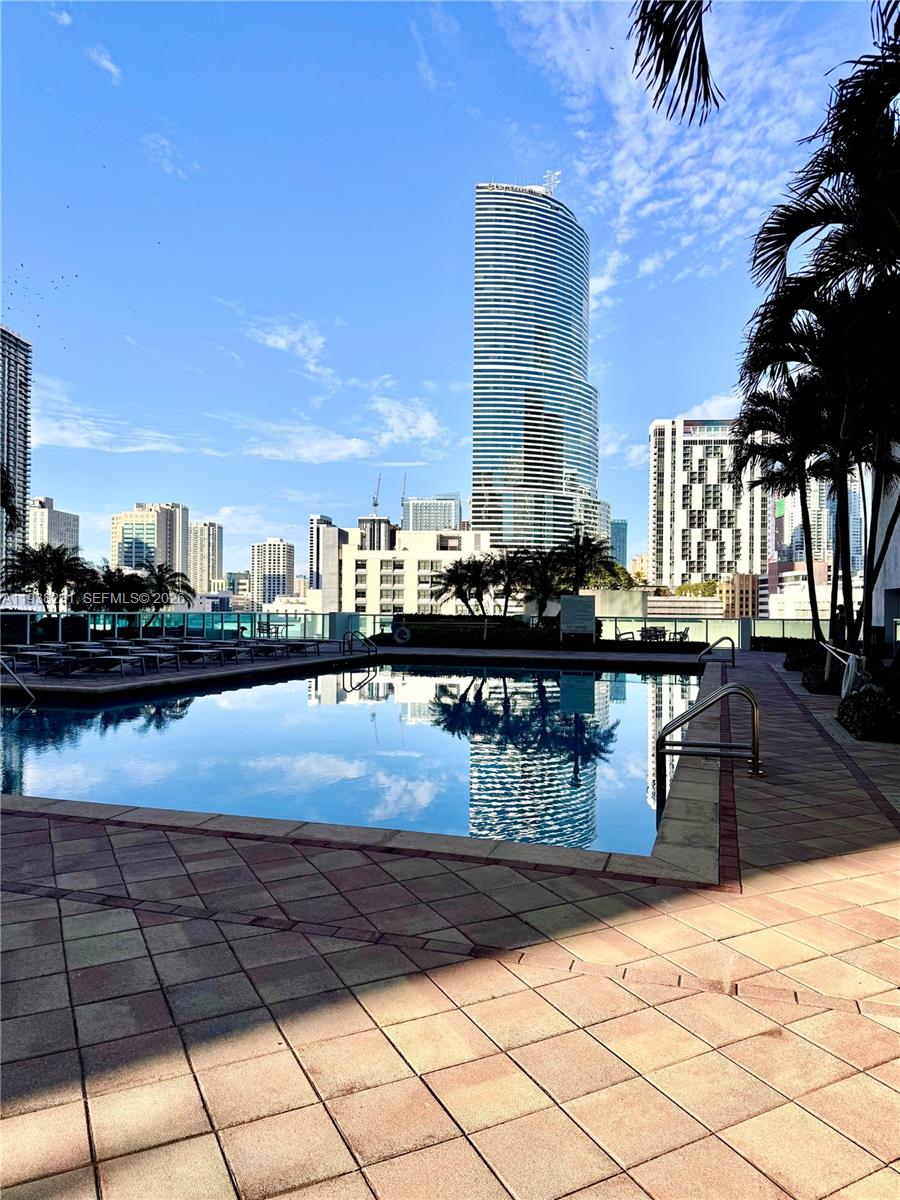 31 Southeast 5th Street, Unit 2710 Miami, FL 33131 - Photo 12 of 25 a view of a swimming pool with outdoor seating