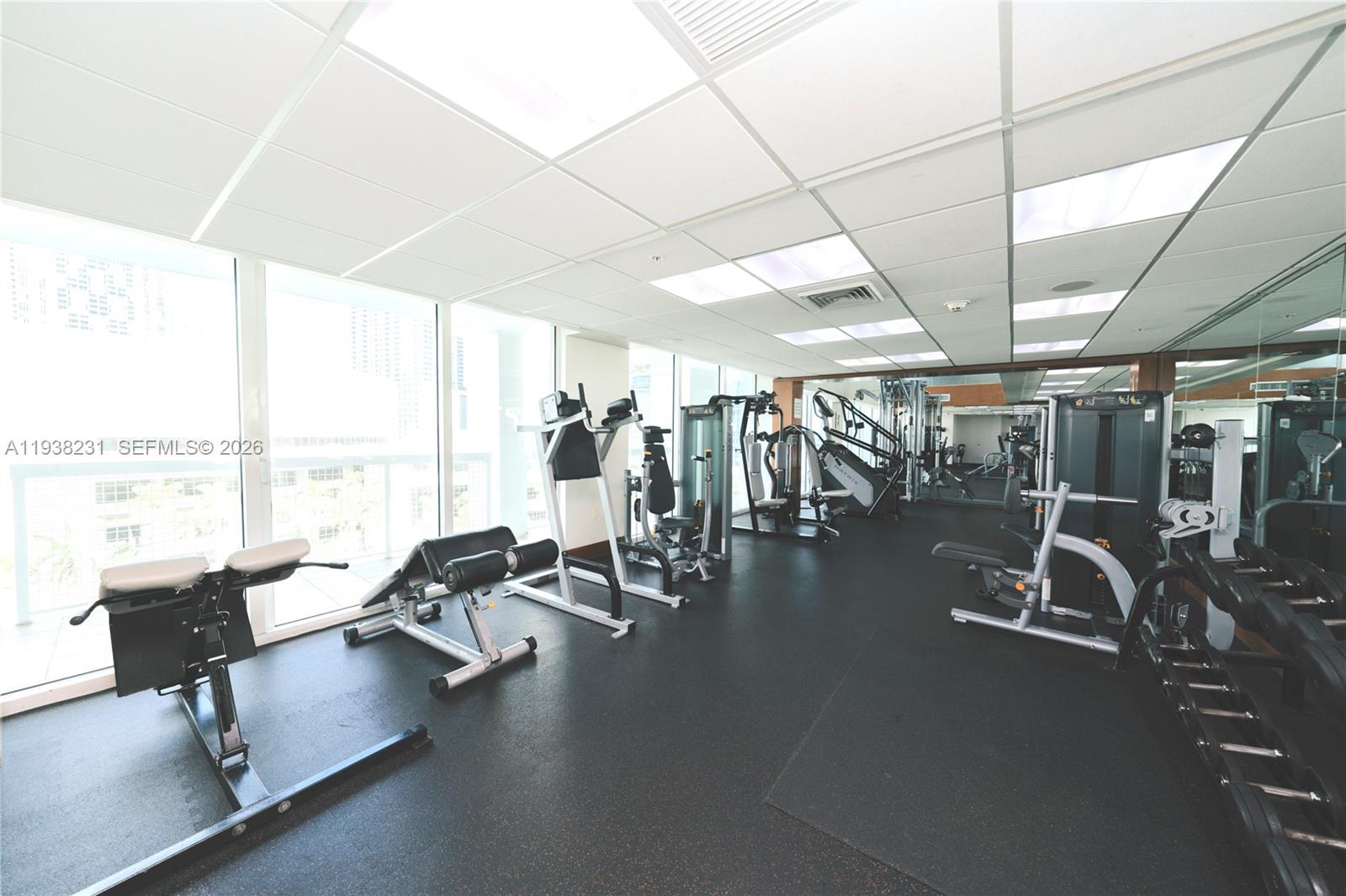 31 Southeast 5th Street, Unit 2710 Miami, FL 33131 - Photo 17 of 25 a view of a room with gym equipment