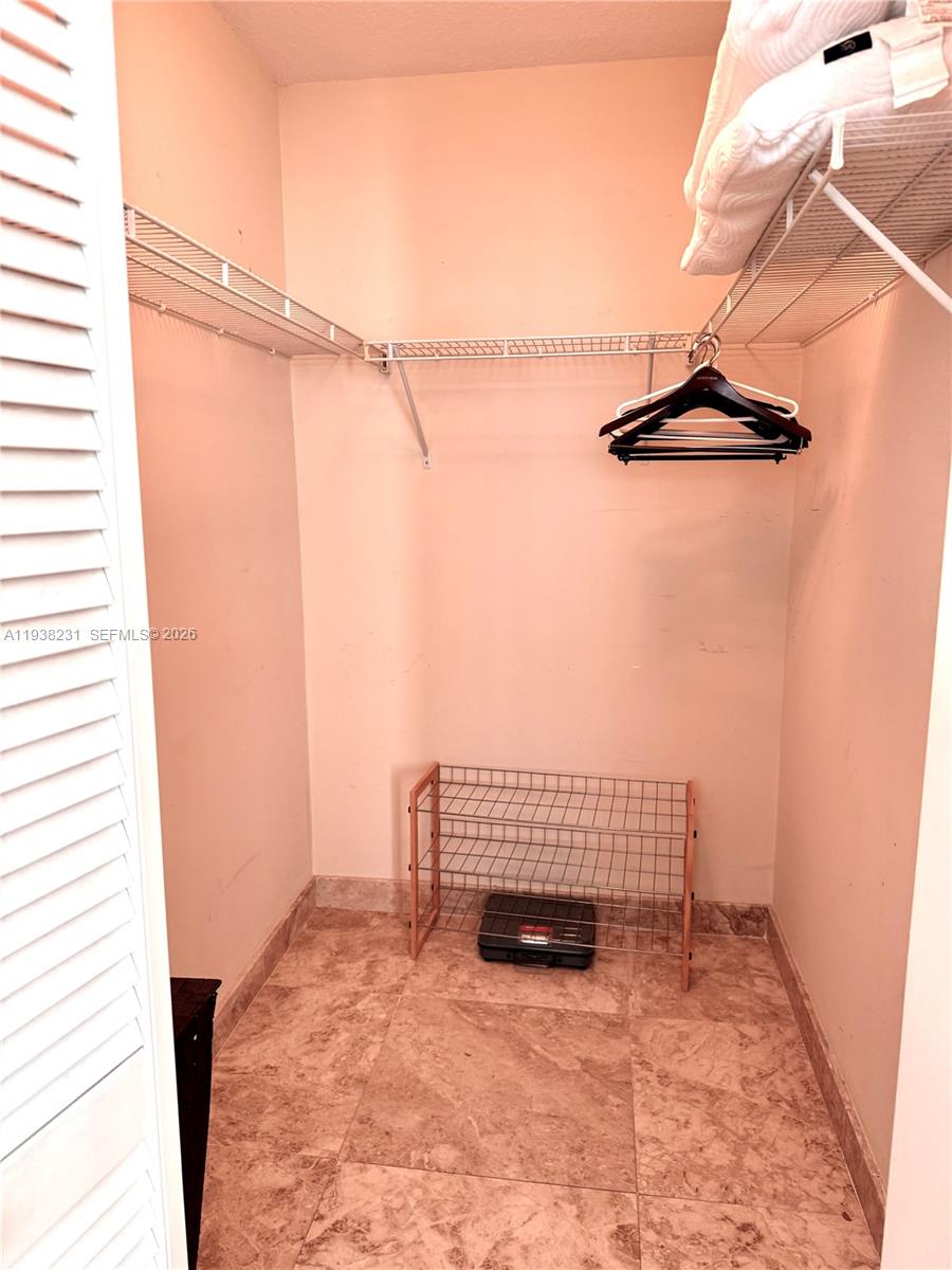 31 Southeast 5th Street, Unit 2710 Miami, FL 33131 - Photo 8 of 25 a view of staircase with white walls