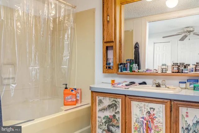 a bathroom with a tub and a window