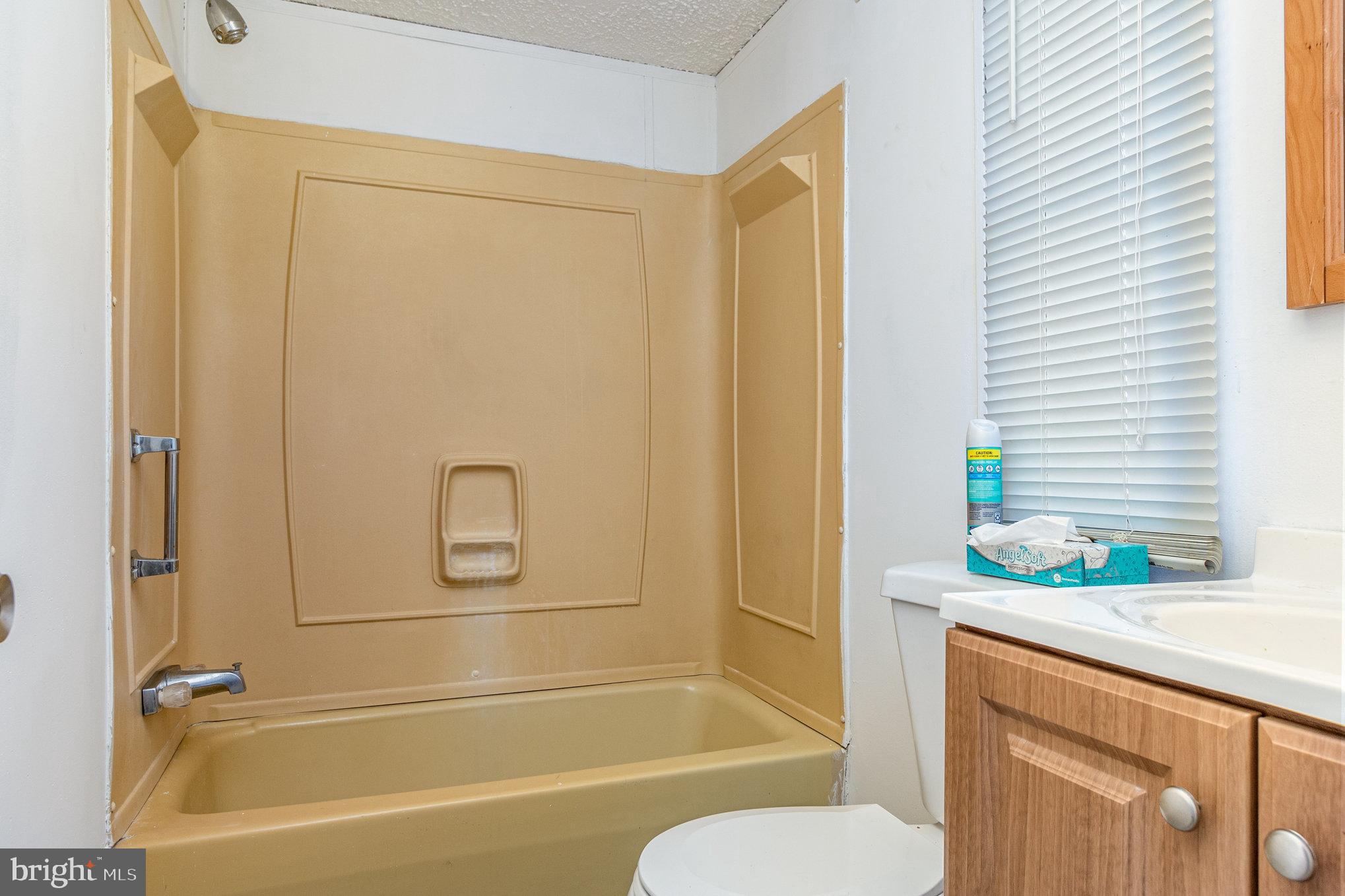 63 Peppermint Lane Middle River, MD 21220 - Photo 14 of 24 a bathroom with a granite countertop sink toilet and shower