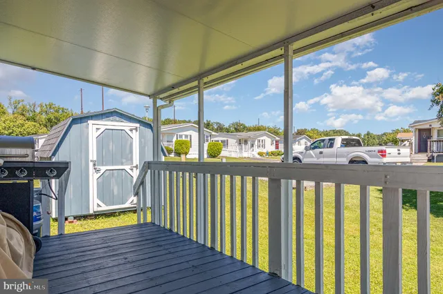 a view of a balcony with furniture