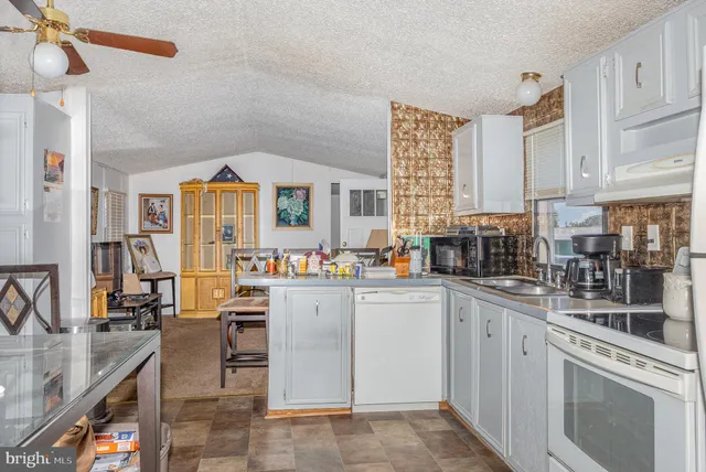 a kitchen that has a lot of cabinets in it