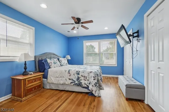 a bed room with a bed and a window