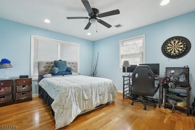 a bedroom with a bed and a chair